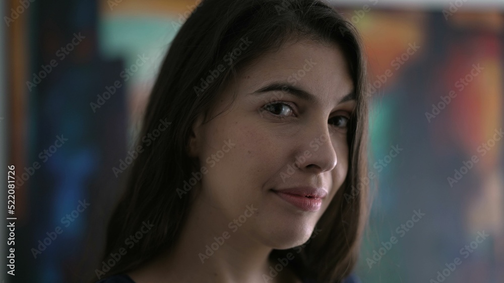 Portrait of person smiling at camera. Closeup happy woman face in 30s Portrait of person smiling at camera. Closeup happy woman face in 30s