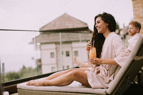 Young couple relaxing on be...