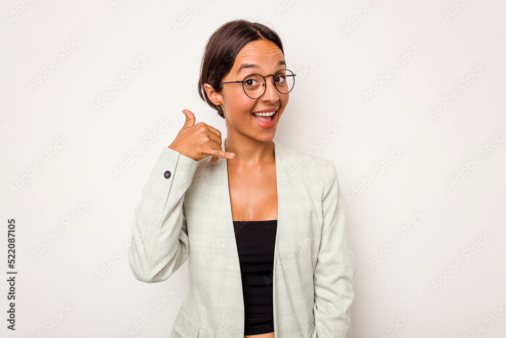 Young hispanic woman isolated on white background showing a mobile phone call gesture with fingers. Young hispanic woman isolated on white background showing a mobile phone call gesture with fingers.