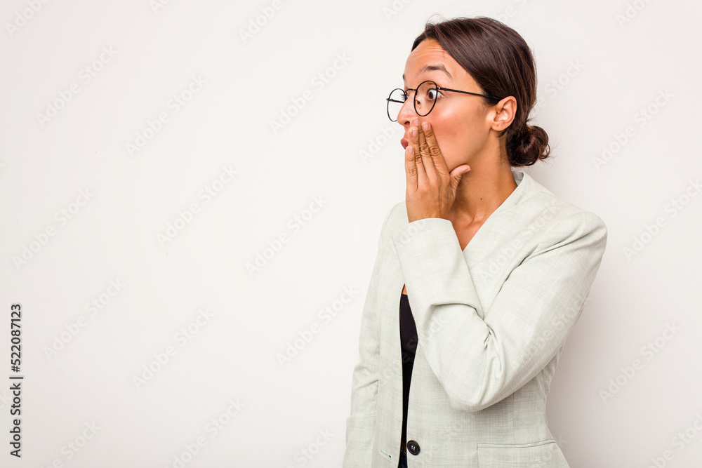 Young hispanic woman isolated on white background being shocked because of something she has seen.