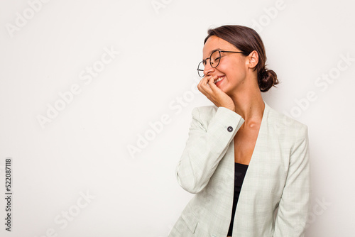 Young hispanic woman isolated on white background laughing happy, carefree, natural emotion.