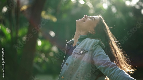 Photos Carefree happy woman arms raised outside looking at sky feeling grateful