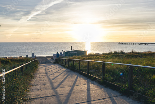 Canvas Print Sea embankment at sunset with a clear cloudless sky.