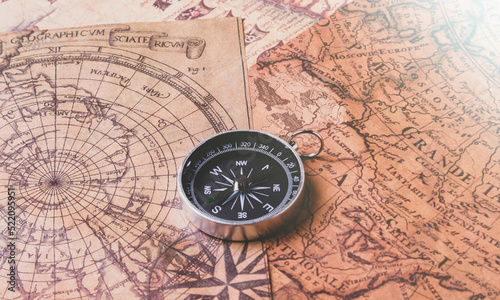 Looking for adventure. Compass and maps. Treasure map and path to the treasure. © Verrone
