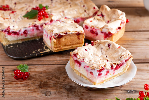 Homemade cottage cheese casserole garnished with redcurrant on wooden table