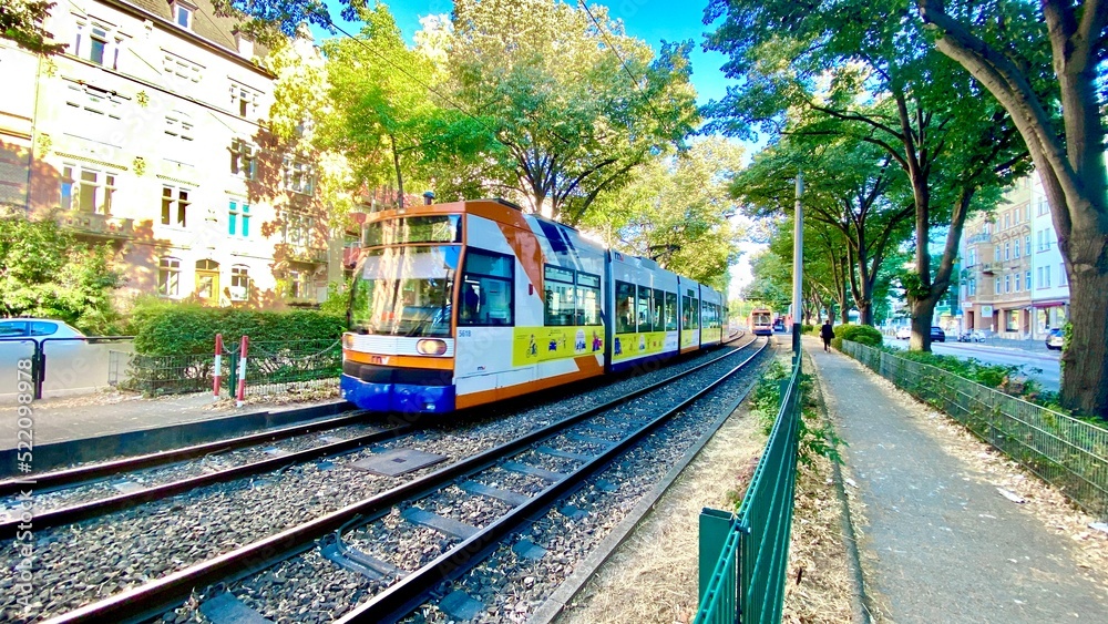 Naklejka premium tram passing between trains in Mannheim, Germany