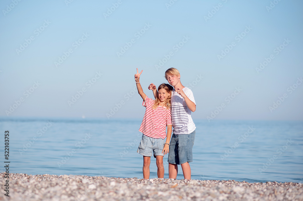 children play on the seashore. family vacation at sea children play on the seashore. family vacation at sea