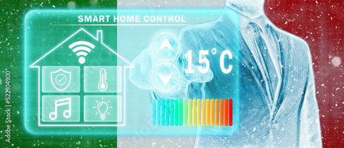 Frozen citizen of Italy adjusting heating temperature on a virtual screen of smart home controller, winter blizzard. Concept of forced thrift, energy war and increased price for natural gas