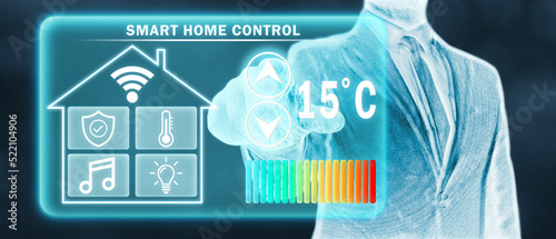 Tableau sur toile Frozen man adjusting heating temperature on a virtual screen of smart home controller
