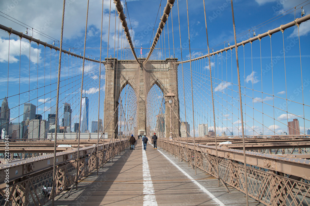 Fototapeta premium New York, NY, USA - February 2nd, 2017 - Strolling the fabulous Brooklyn Bridge