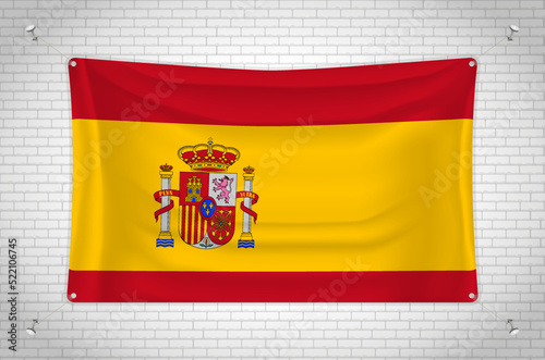 Spain flag hanging on brick wall. 3D drawing. Flag attached to the wall. Neatly drawing in groups on separate layers for easy editing.