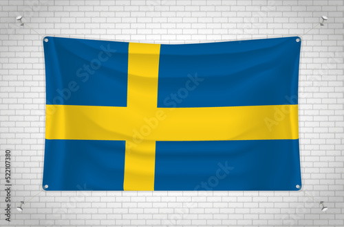 Sweden flag hanging on brick wall. 3D drawing. Flag attached to the wall. Neatly drawing in groups on separate layers for easy editing.