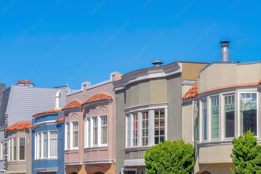 Side view of adjacent homes with curved window walls in San Franciso, California