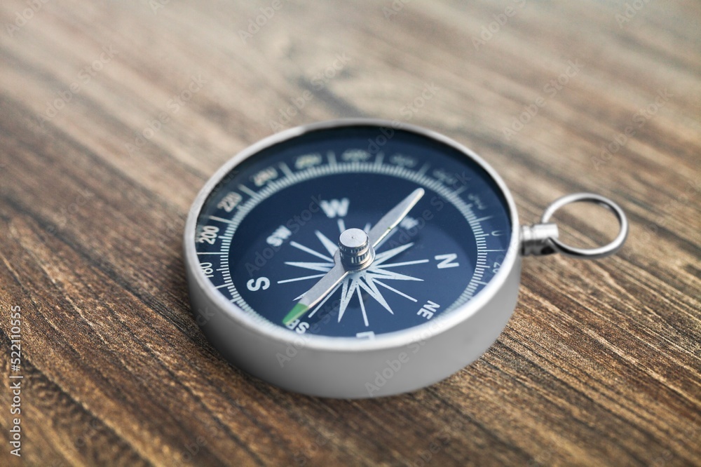 Compass. Traditional navigation device indicating the cardinal points (north, south, east, and west). Compass. Traditional navigation device indicating the cardinal points (north, south, east, and west).