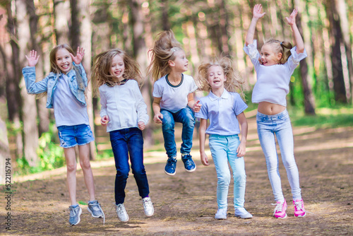A group of girls having fun in the forest.