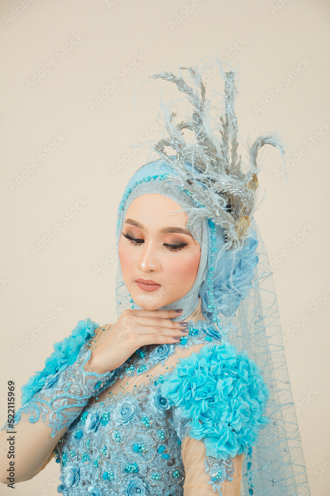 Beauty Fashion asian woman in hijab with Makeup and wearing blue wedding dress. Beauty Fashion asian woman in hijab with Makeup and wearing blue wedding dress.