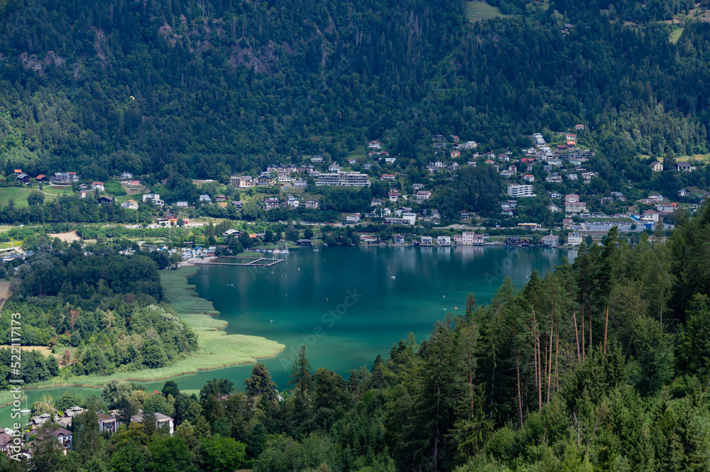 color photo of Ossiacher lake with view to the mountain Gerlitzen in the background in Austria