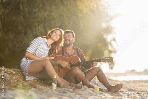 couple playing guitar