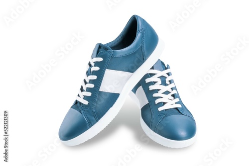 Blue sneakers on a white isolated background