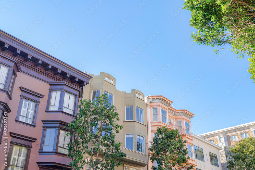 Victorian townhouses with trees at the front in San Francisco, California