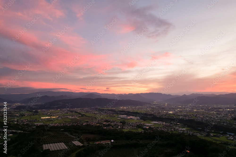 日本の田舎町　信州上田の町並みの夕景を空撮