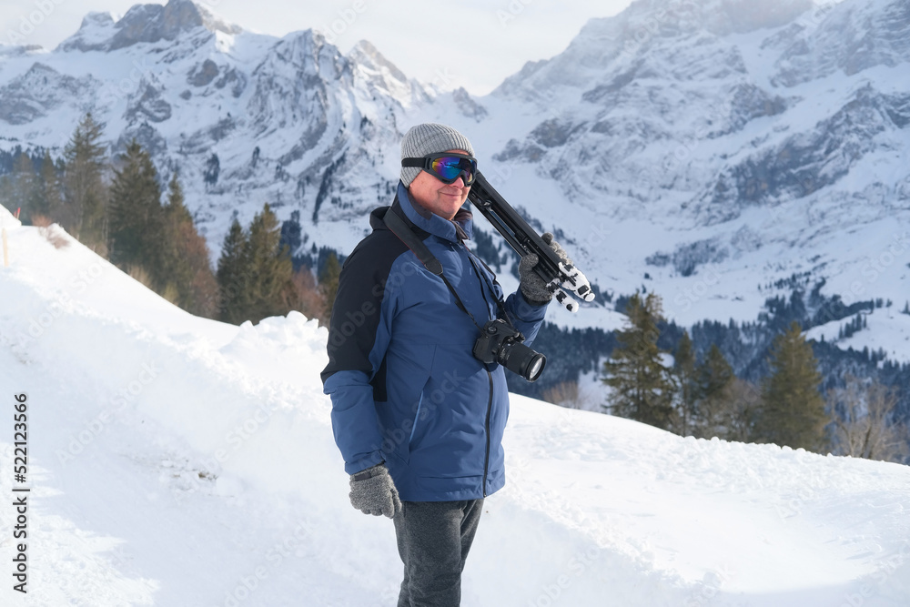 elderly man with camera, mountain hiker admiring mountain winter landscape, Sports Concept, Healthy Lifestyle, Winter Activity, beautiful winter natural landscape, walks in winter white forest