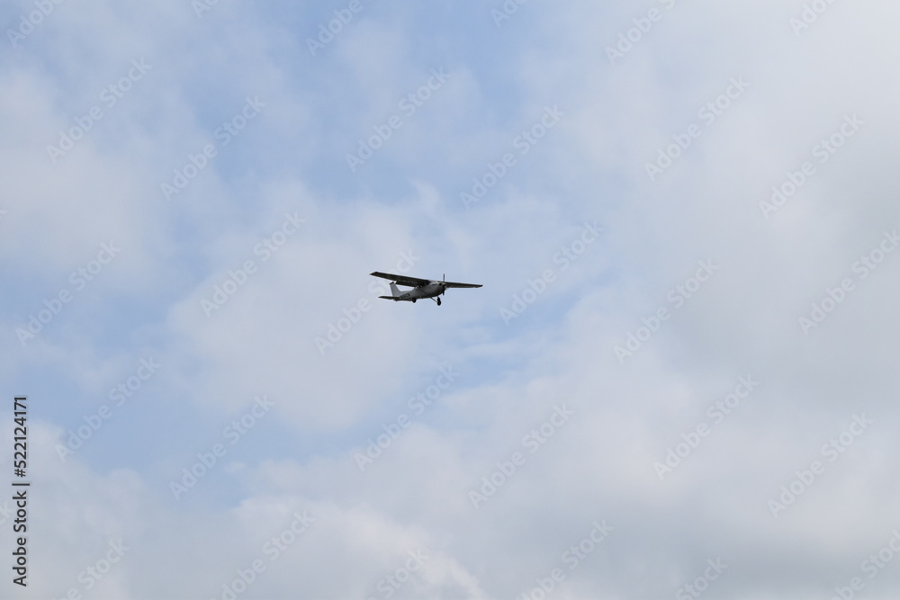 Airplane in a Cloudy Sky Airplane in a Cloudy Sky