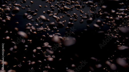 Explosion brown coffee grains close up. Super slow motion of splashing beans.