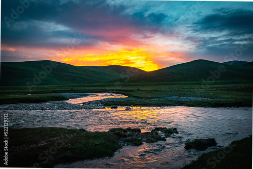 river, sunset at mountains in Kyrgyzstan, Song-Köl, Central Asia,