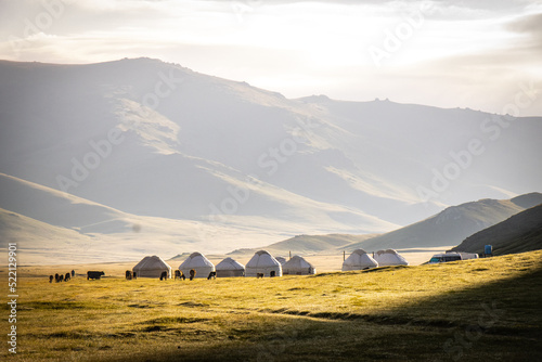 yurt camp, near near song-köl lake, kyrgyzstan, central asia, tent, camping, grazing cows, early morning light © Andrea Aigner