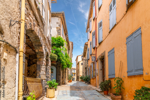 A charming, picturesque street in the medieval village of Grimaud, France, in the hills above Saint-Tropez along the French Riviera.