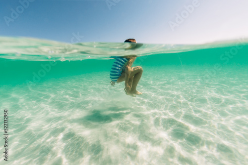 A girl floating in clear water photo