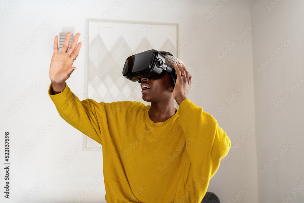 Amazed black gamer interacting with virtual reality Amazed black gamer interacting with virtual reality