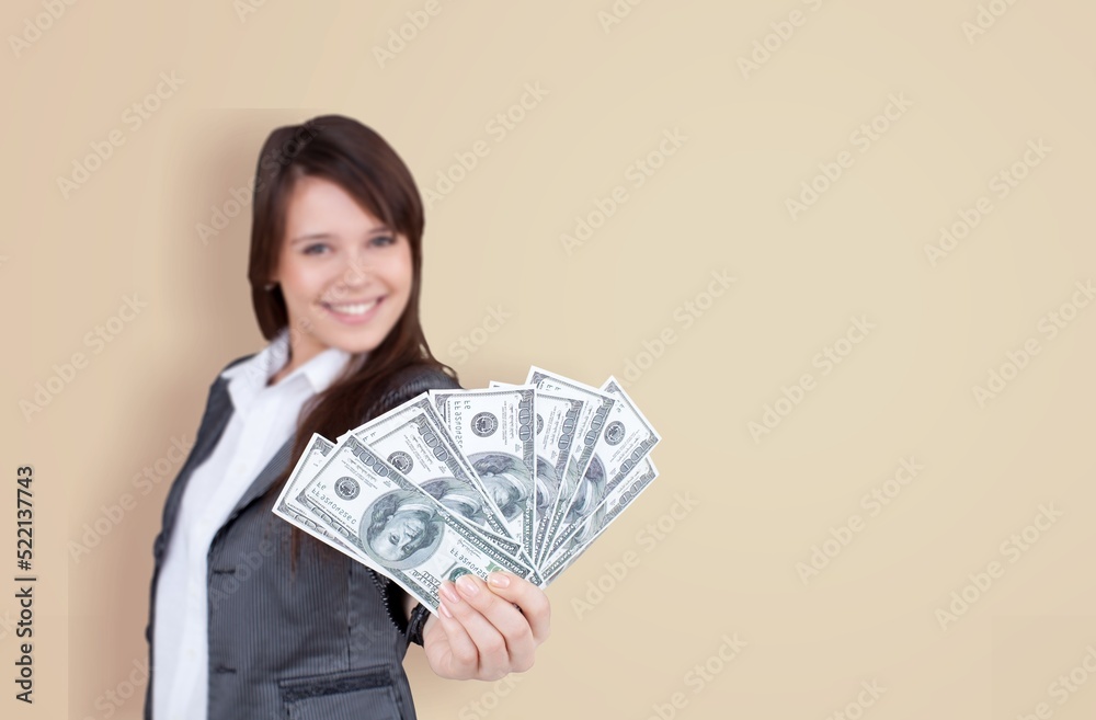 Enthusiastic modern woman winning money, got cash, celebrating and shouting of joy, standing against background Enthusiastic modern woman winning money, got cash, celebrating and shouting of joy, standing against background