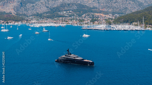 drone View Of a black super yacht in Turkish marina photo