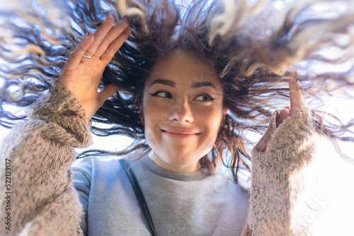 portrait of a happy girl from below photo