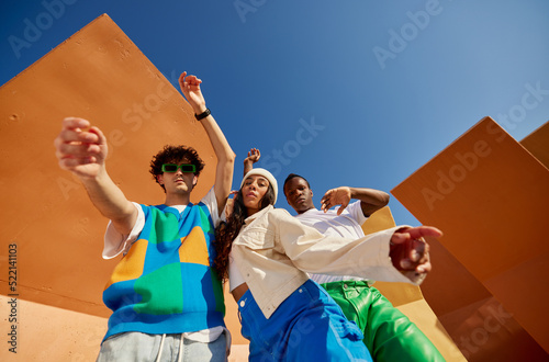 Multiracial young dancers performing in park