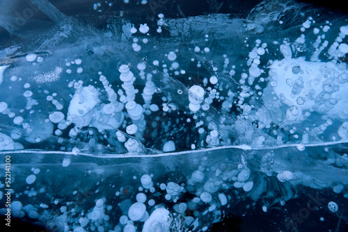 Bubbling methane greenhouse gases entombed in freezing Arctic sea ice photo