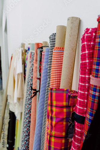 Obraz na płótnie tubes of fabrics with which to design garments. w salonie