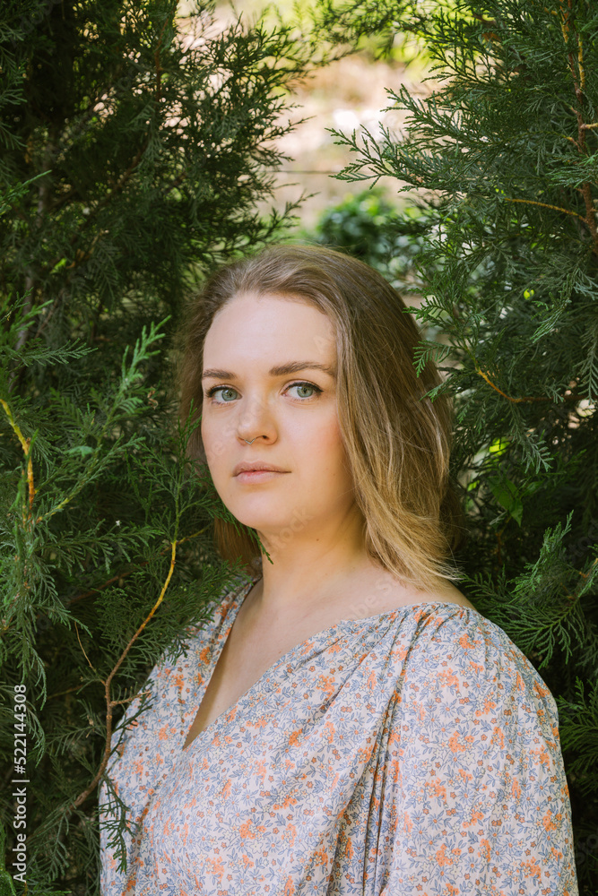 Beautiful plus size woman in a summer park Beautiful plus size woman in a summer park