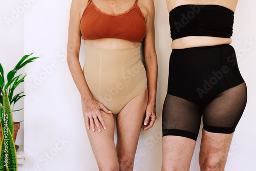 Crop senior women with cotton underwear photo