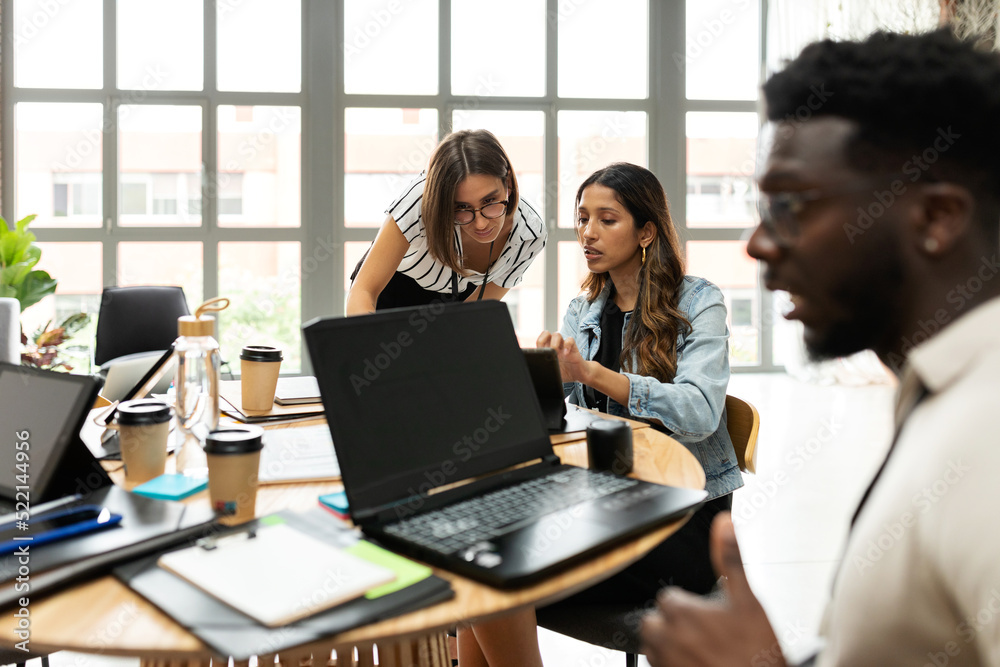 Mixed coworkers in coworking area Mixed coworkers in coworking area