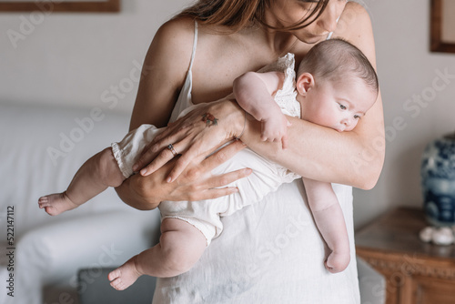 Mother Holding Her Daughter photo