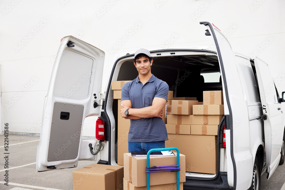 Self-assured courier near loaded van Self-assured courier near loaded van