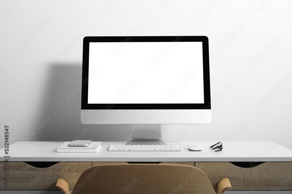 Workplace with modern computer and smartphone on white table. Mockup for design Workplace with modern computer and smartphone on white table. Mockup for design