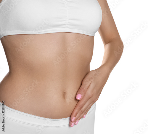 Woman in underwear touching her belly on white background, closeup. Healthy stomach © New Africa