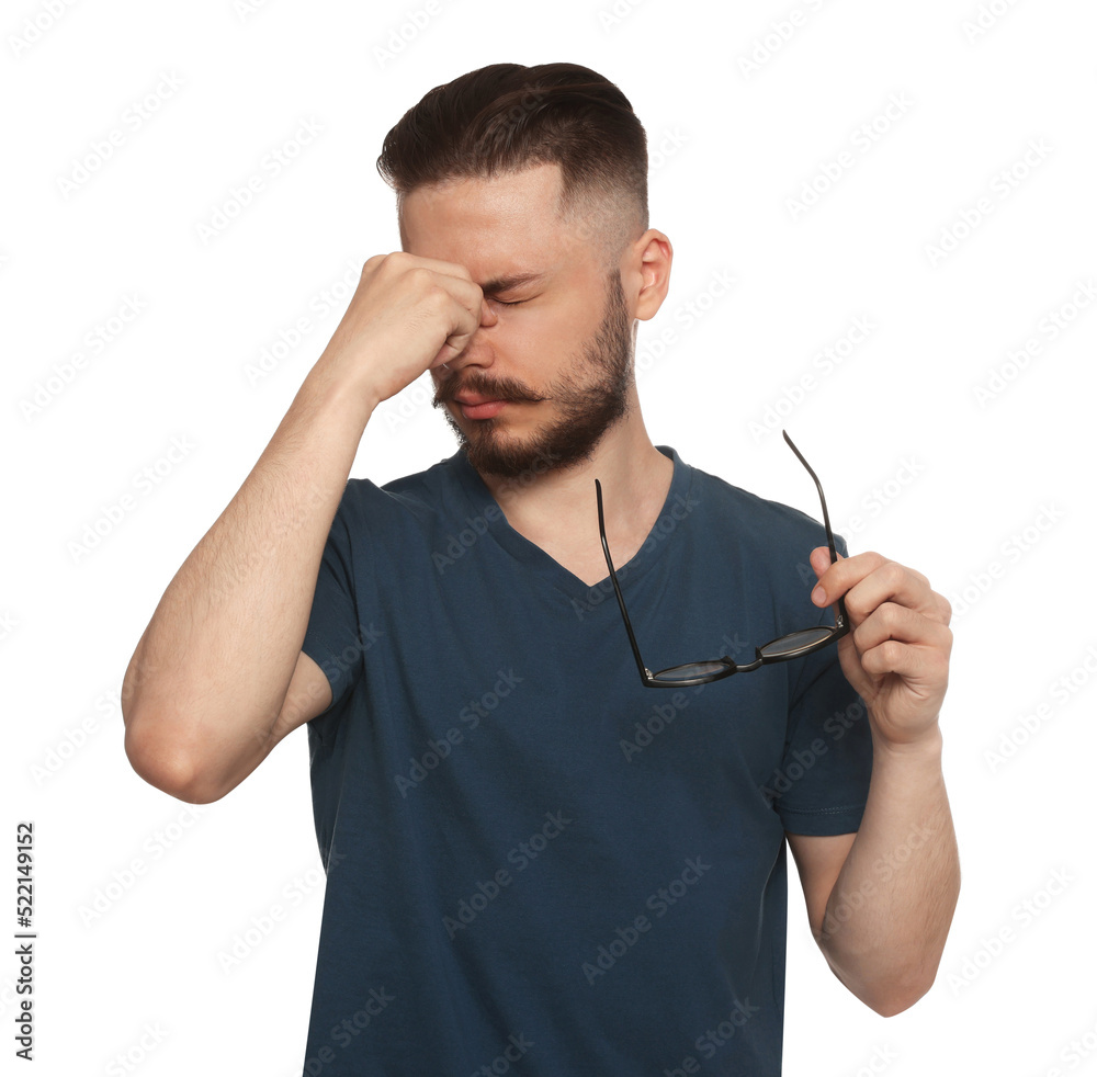 Young man suffering from eyestrain on white background Young man suffering from eyestrain on white background