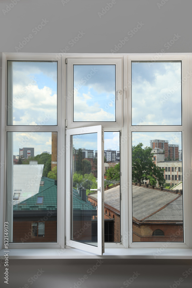 Open window with white plastic frame indoors Open window with white plastic frame indoors