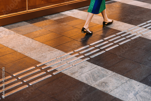 Female legs on the road