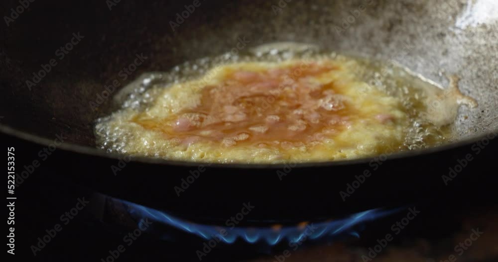 Close up process of cooking omelet in a hot pan. Close up process of cooking omelet in a hot pan.